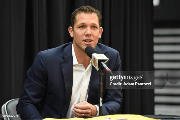 Luke Walton of the Los Angeles Lakers helps introduce 2018 NBA draft pick Moritz Wagner during an introductory press conference at the UCLA Health...