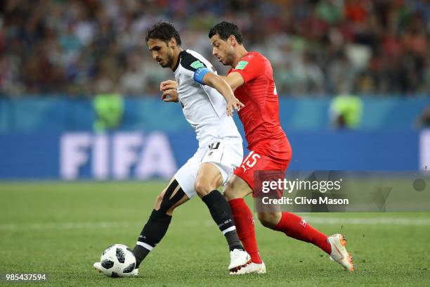 Bryan Ruiz of Costa Rica is challenged by Blerim Dzemaili of Switzerland during the 2018 FIFA World Cup Russia group E match between Switzerland and...