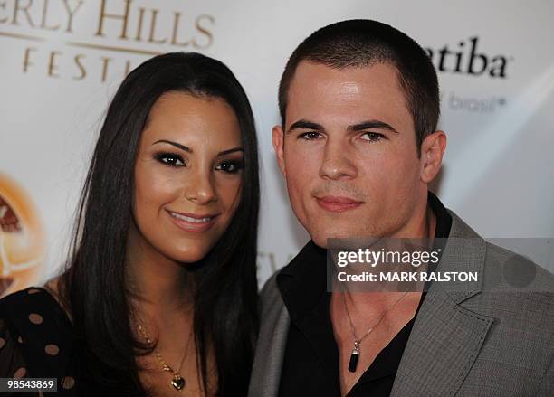 Actor Chandler Rylko and actress Amanda Miller pose on the red carpet as they arrive for the premiere of "As Good as Dead" at the Clarity Theater in...