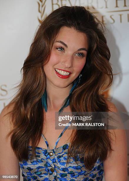 Rainey Qualley, daughter of actress Andie MacDowell, poses on the red carpet as she arrives for the premiere of "As Good as Dead" at the Clarity...