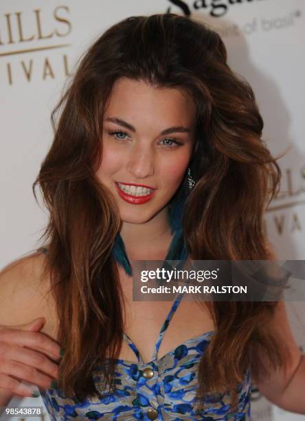 Rainey Qualley, daughter of actress Andie MacDowell, poses on the red carpet as she arrives for the premiere of "As Good as Dead" at the Clarity...