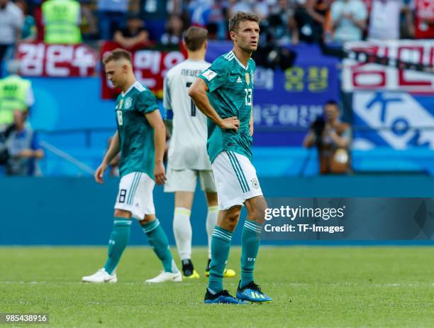 Joshua Kimmich of Germany, Thomas Mueller of Germany and Goalkeeper Manuel Neuer of Germany look dejected after the 2018 FIFA World Cup Russia group...