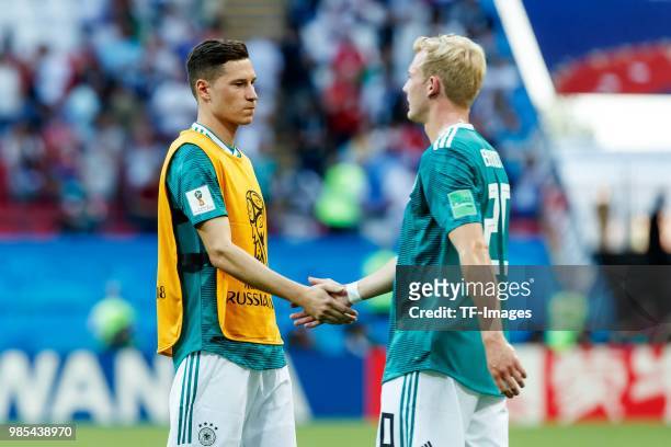 Julian Draxler of Germany and Julian Brandt of Germany look dejected after the 2018 FIFA World Cup Russia group F match between Korea Republic and...
