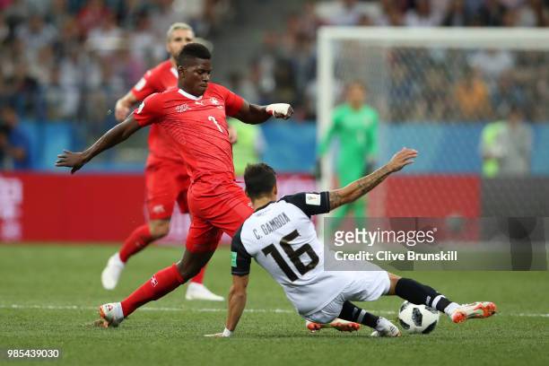 Cristian Gamboa of Costa Rica fouls Breel Embolo of Switzerland during the 2018 FIFA World Cup Russia group E match between Switzerland and Costa...