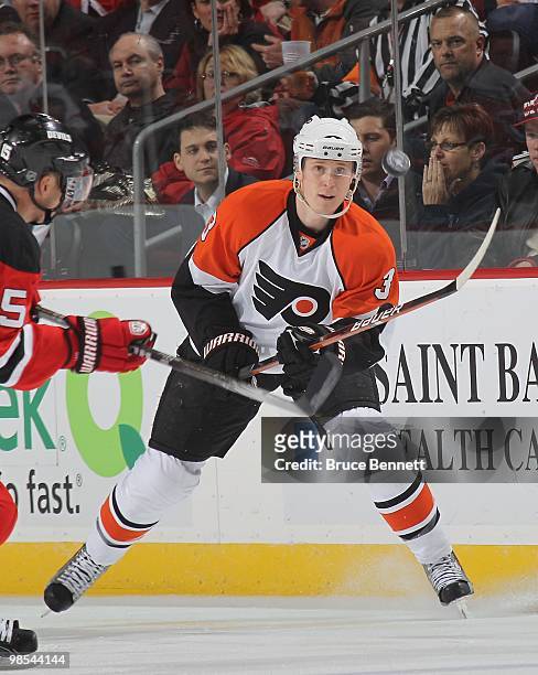 Oskars Bartulis of the Philadelphia Flyers plays the puck against the New Jersey Devils in Game Two of the Eastern Conference Quarterfinals during...