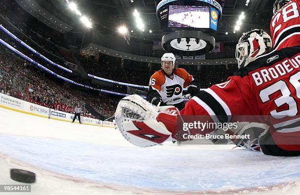 Arron Asham of the Philadelphia Flyers scores a first period goal against the New Jersey Devils in Game Two of the Eastern Conference Quarterfinals...