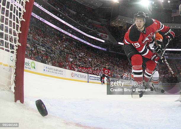 Travis Zajac of the New Jersey Devils watches a puck cross the line in his game against the Philadelphia Flyers in Game Two of the Eastern Conference...