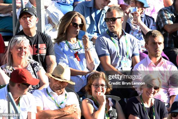 Kim Sears watches her husband Andy Murray play his match against Kyle Edmund on day six of the Nature Valley International at Devonshire Park on June...