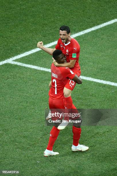 Blerim Dzemaili of Switzerland celebrates with teammate Breel Embolo after scoring his team's first goal during the 2018 FIFA World Cup Russia group...