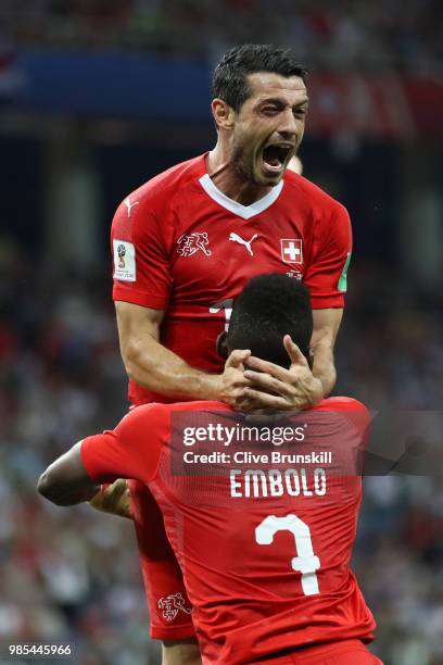 Blerim Dzemaili of Switzerland celebrates with teammate Breel Embolo after scoring his team's first goal during the 2018 FIFA World Cup Russia group...