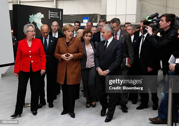 Annette Schavan, German's research minister, front left, Angela Merkel, Germany's chancellor, front center, and Claudio Scajola, Italy's economy...