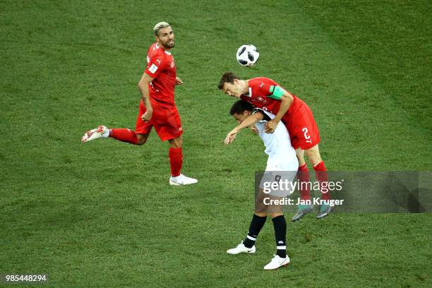 Stephan Lichtsteiner of Switzerland wins a header from Daniel Colindres of Costa Rica during the 2018 FIFA World Cup Russia group E match between...