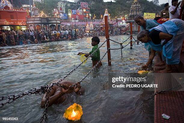 Hindu devotess bathe in the river Ganges during the Kumbh Mela festival in Haridwar on April 13, 2010. The Kumbh Mela, the world's largest religious...