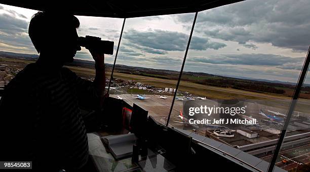 Greig Reid an air traffic controller looks from the air traffic control tower at Edinburgh Airport as flights are cancelled for a fifth day on April...