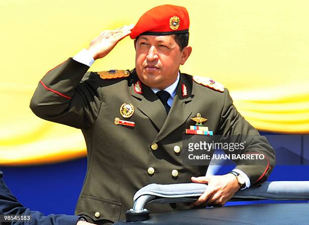 Venezuelan President Hugo Chavez salutes during a military parade at Fort Tiuna held as part of the celebrations of the Bicentenary of the Venezuelan...