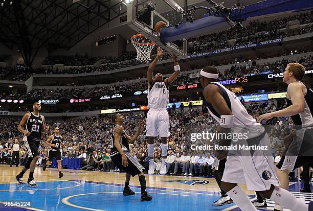 Guard Shawn Marion of the Dallas Mavericks takes a shot against George Hill of the San Antonio Spurs in Game One of the Western Conference...