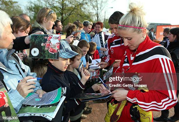 Anja Mittag signs autographes after a training session at the Philippe Mueller stadium on April 19, 2010 in Dresden, Germany.