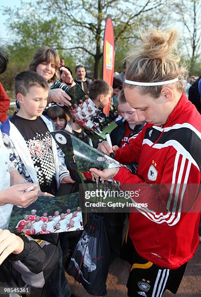 Babett Peter signs autographes after a training session at the Philippe Mueller stadium on April 19, 2010 in Dresden, Germany.