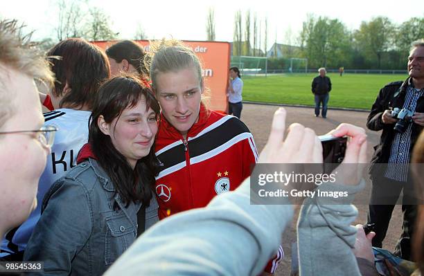 Simone Laudehr takes pictures with fans after a training session at the Philippe Mueller stadium on April 19, 2010 in Dresden, Germany.