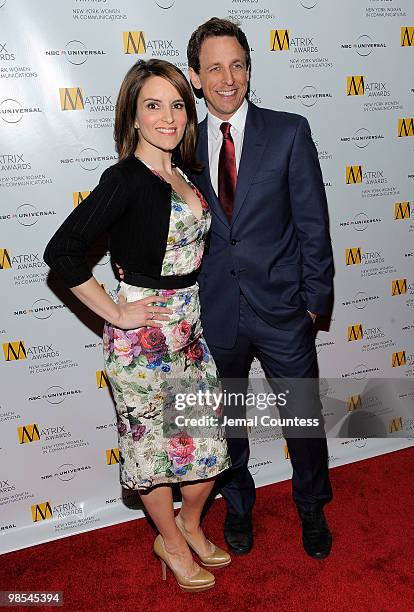 Comedians Tina Fey and Seth Meyers pose for photos at the 2010 Matrix Awards presented by New York Women in Communications at The Waldorf Astoria on...