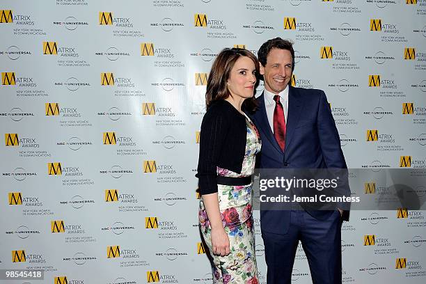 Comedians Tina Fey and Seth Meyers pose for photos at the 2010 Matrix Awards presented by New York Women in Communications at The Waldorf Astoria on...