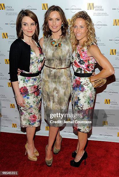 Comedian Tina Fey, actress Mariska Hargitay and singer Sheryl Crow pose for photos at the 2010 Matrix Awards presented by New York Women in...