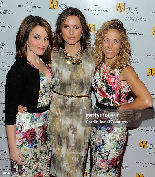 Comedian Tina Fey, actress Mariska Hargitay and singer Sheryl Crow pose for photos at the 2010 Matrix Awards presented by New York Women in...