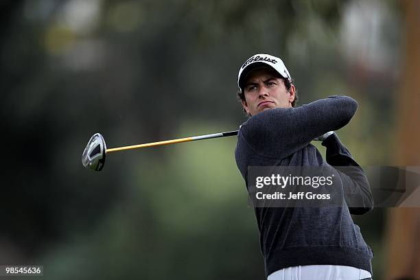 Adam Scott of Australia hits a shot during the first round of the Northern Trust Open at Riviera Country Club on February 4, 2010 in Pacific...