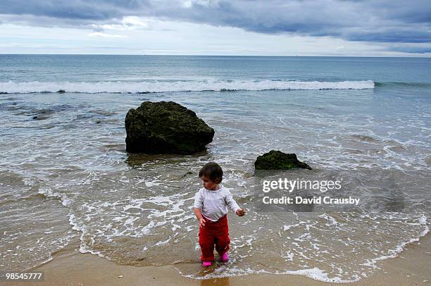 girl on beach - crausby stockfoto's en -beelden