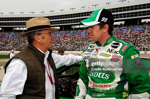 Carl Edwards, driver of the Scotts Ford, talks with team owner Jack Roush on the grid prior to the start of the NASCAR Sprint Cup Series Samsung...