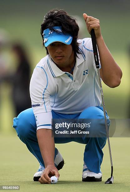 Ryo Ishikawa of Japan lines up a putt during the first round of the Northern Trust Open at Riviera Country Club on February 4, 2010 in Pacific...