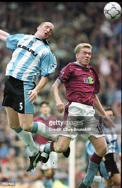 Coventry's John Hartson heads the ball away from Aston Villa's Steve Staunton during the FA Carling Premier League game between Aston Villa and...