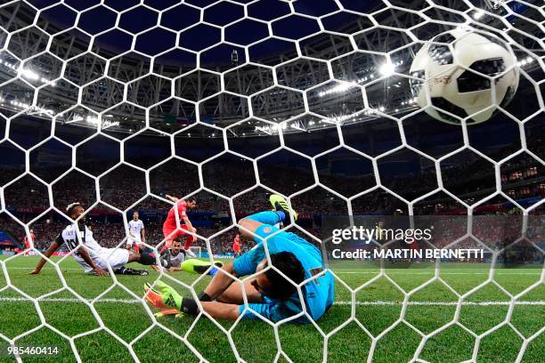 Switzerland's midfielder Blerim Dzemaili reacts as he scores the opening goal past Costa Rica's goalkeeper Keylor Navas during the Russia 2018 World...