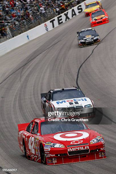 Juan Pablo Montoya, driver of the Target Chevrolet, leads a pack of cars during the NASCAR Sprint Cup Series Samsung Mobile 500 at Texas Motor...