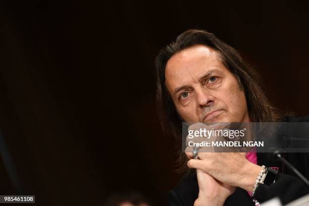 Mobile CEO John Legere prepares to testify at the Senate Judiciary Committee's Subcommittee on Antitrust, Competition Policy and Consumer Rights...