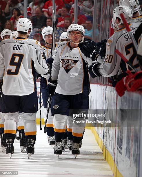 Martin Erat of the Nashville Predators celebrates a goal with teammates on the bench during an NHL game against the Detroit Red Wings at Joe Louis...