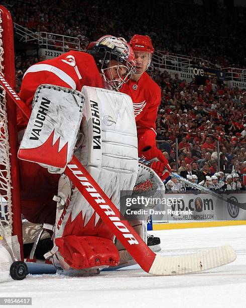 Goaltender Jimmy Howard of the Detroit Red Wings makes a stick save during an NHL game against the Nashville Predators at Joe Louis Arena on April 3,...