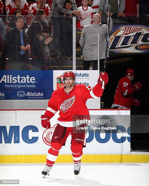 Patrick Eaves of the Detroit Red Wings salutes the fans after an NHL game against the Columbus Blue Jackets at Joe Louis Arena on April 7, 2010 in...