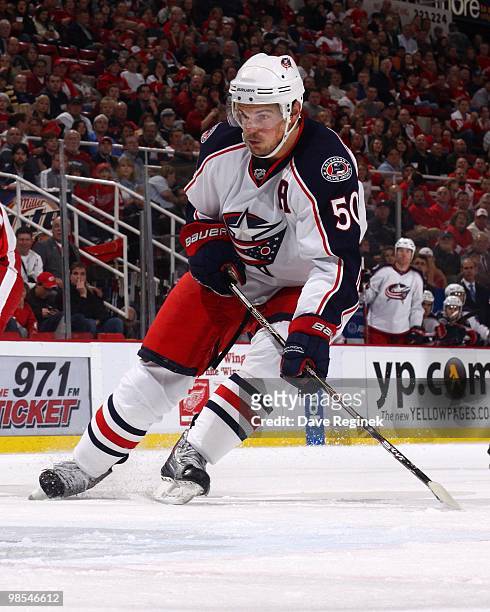 Antoine Vermette of the Columbus Blue Jackets turns in front of the net during an NHL game against the Detroit Red Wings at Joe Louis Arena on April...