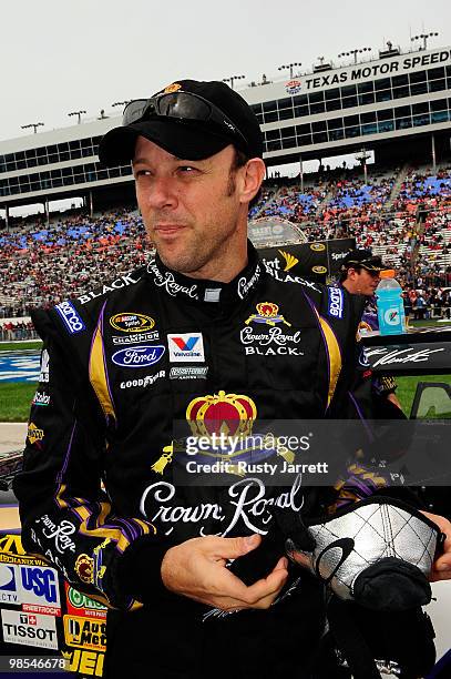 Matt Kenseth, driver of the Crown Royal Black Ford, looks on from the grid prior to the start of the NASCAR Sprint Cup Series Samsung Mobile 500 at...