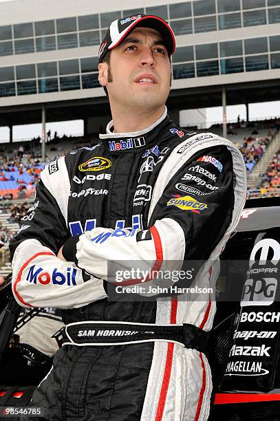 Sam Hornish Jr., driver of the Mobil 1 Dodge, looks on from the grid prior to the start of the NASCAR Sprint Cup Series Samsung Mobile 500 at Texas...