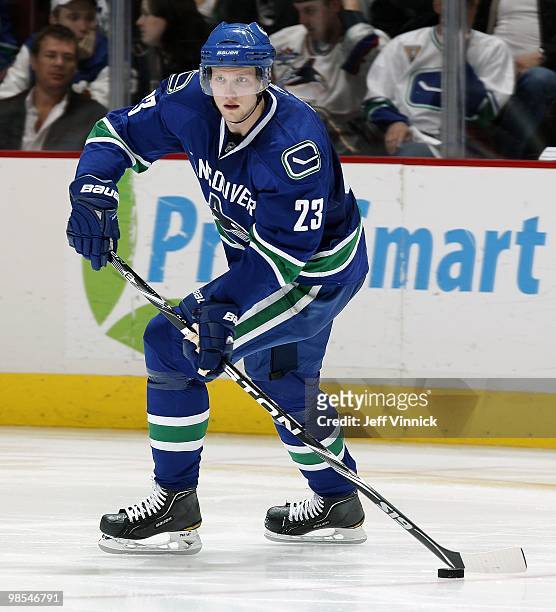 Alexander Edler of the Vancouver Canucks skates up ice with the puck in Game One of the Western Conference Quarterfinals against the Los Angeles...