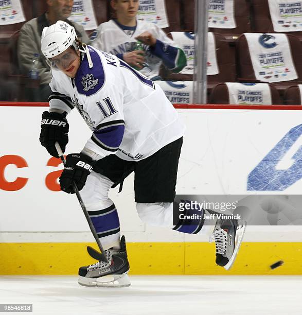 Anze Kopitar of the Los Angeles Kings passes the puck up ice in Game One of the Western Conference Quarterfinals against the Vancouver Canucks during...