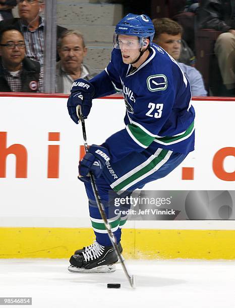 Alexander Edler of the Vancouver Canucks skates up ice with the puck in Game One of the Western Conference Quarterfinals against the Los Angeles...