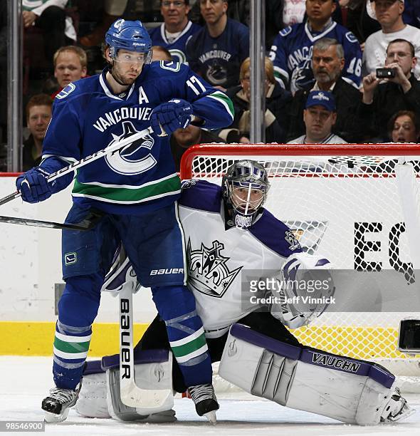 Ryan Kesler of the Vancouver Canucks runs interference in front of Jonathan Quick of the Los Angeles Kings in Game One of the Western Conference...