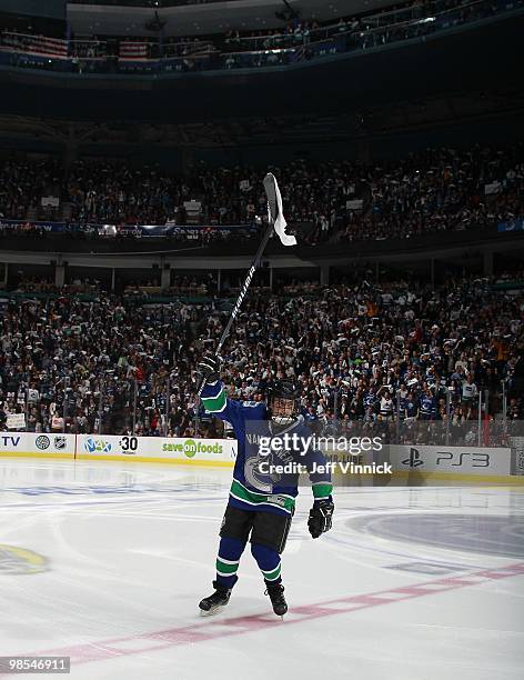 Twelve year-old Vancouver Canucks fan Josh Vinnick waves a white towel as he skates in front of over 18,500 fans at the start of Game One of the...