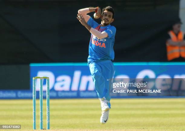 India's Yuzvendra Chahal bowls during the Twenty20 International cricket match between Ireland and India at Malahide cricket club, in Dublin on June...
