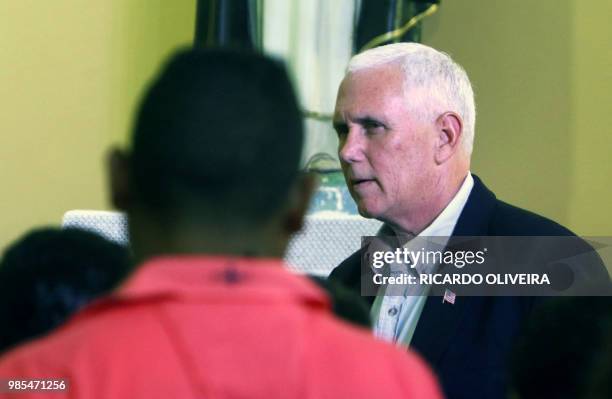 Vice President Mike Pence gestures during a visit to Venezuelan refugees at the Santa Catarina Humanitarian Center in Manaus, on June 27, 2018. - US...