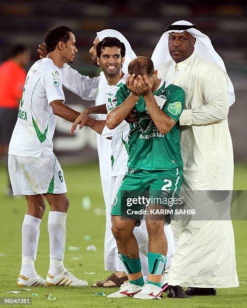 Players of Emirates club celebrate after winning the President Cup final match against Al-Shabab club in Abu Dhabi on April 19, 2010. AFP PHOTO/KARIM...