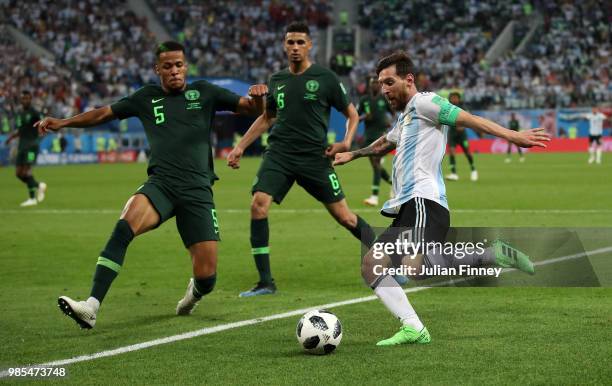 Lionel Messi of Argentina crosses the ball as William Ekong of Nigeria tries to block during the 2018 FIFA World Cup Russia group D match between...